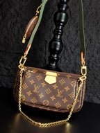 Monogram crossbody bag with gold chain, brown flap and green webbing strap