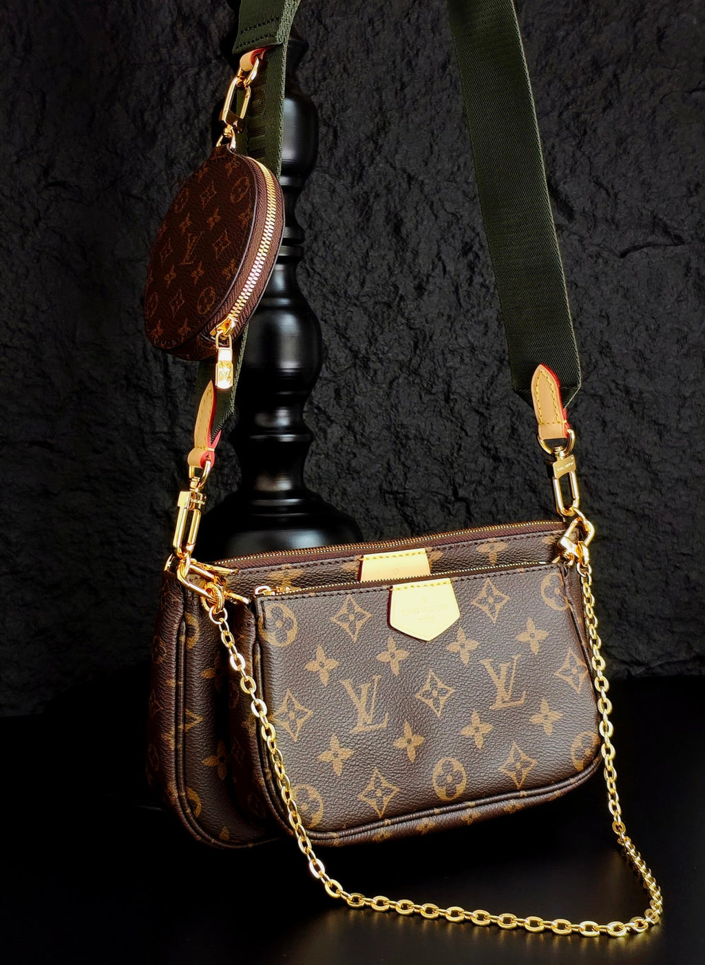 Monogram crossbody bag with gold chain, brown flap and green shoulder strap