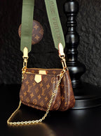 Monogram crossbody bag with gold chain, brown zip pocket and green strap
