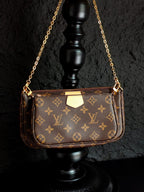 Louis Vuitton crossbody bag with monogram canvas, gold chain handles, front view