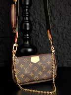 Monogram crossbody bag with gold chain, brown front flap and side zipper