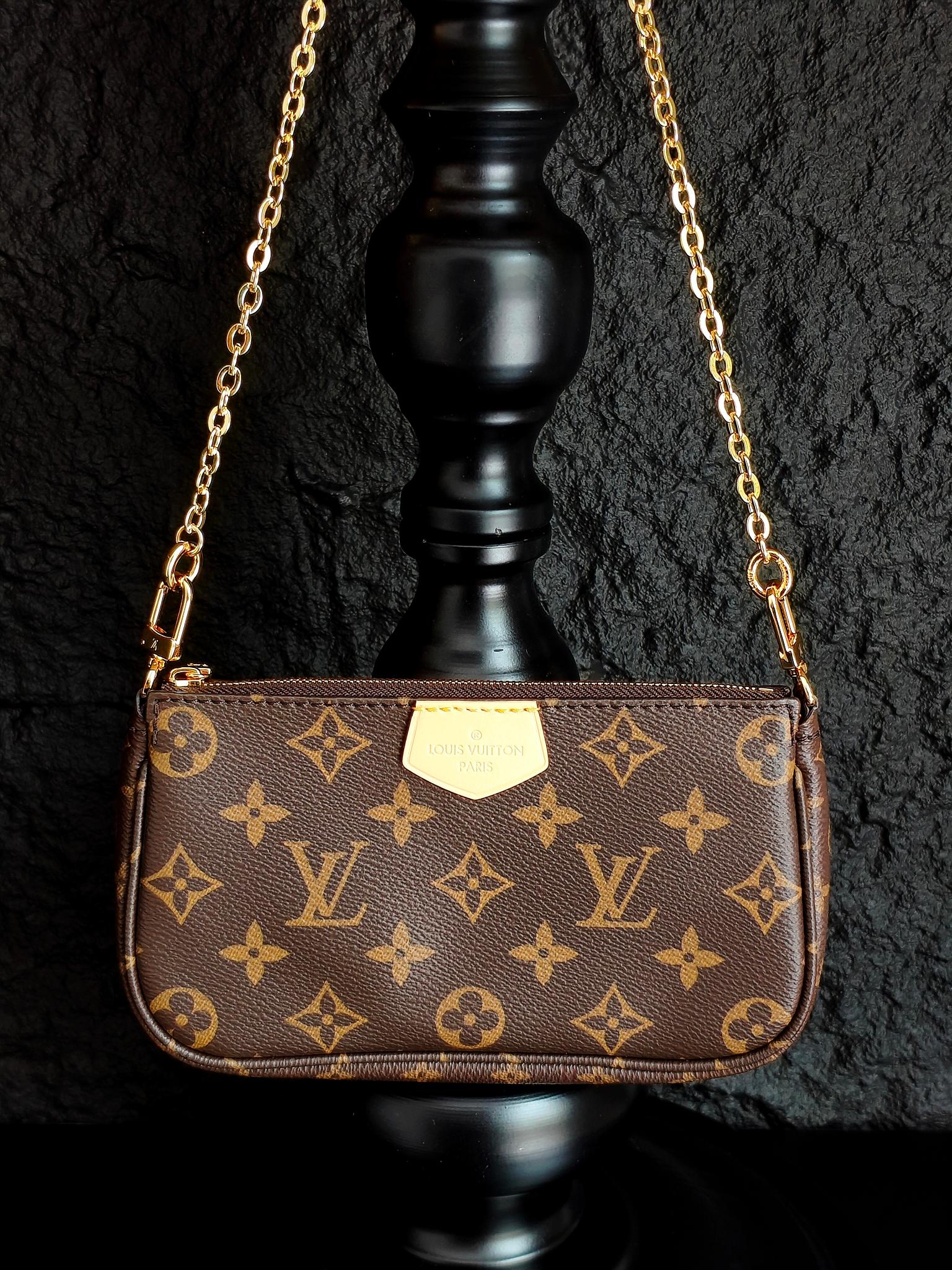 Monogram crossbody bag with gold chain and brown front flap, front view