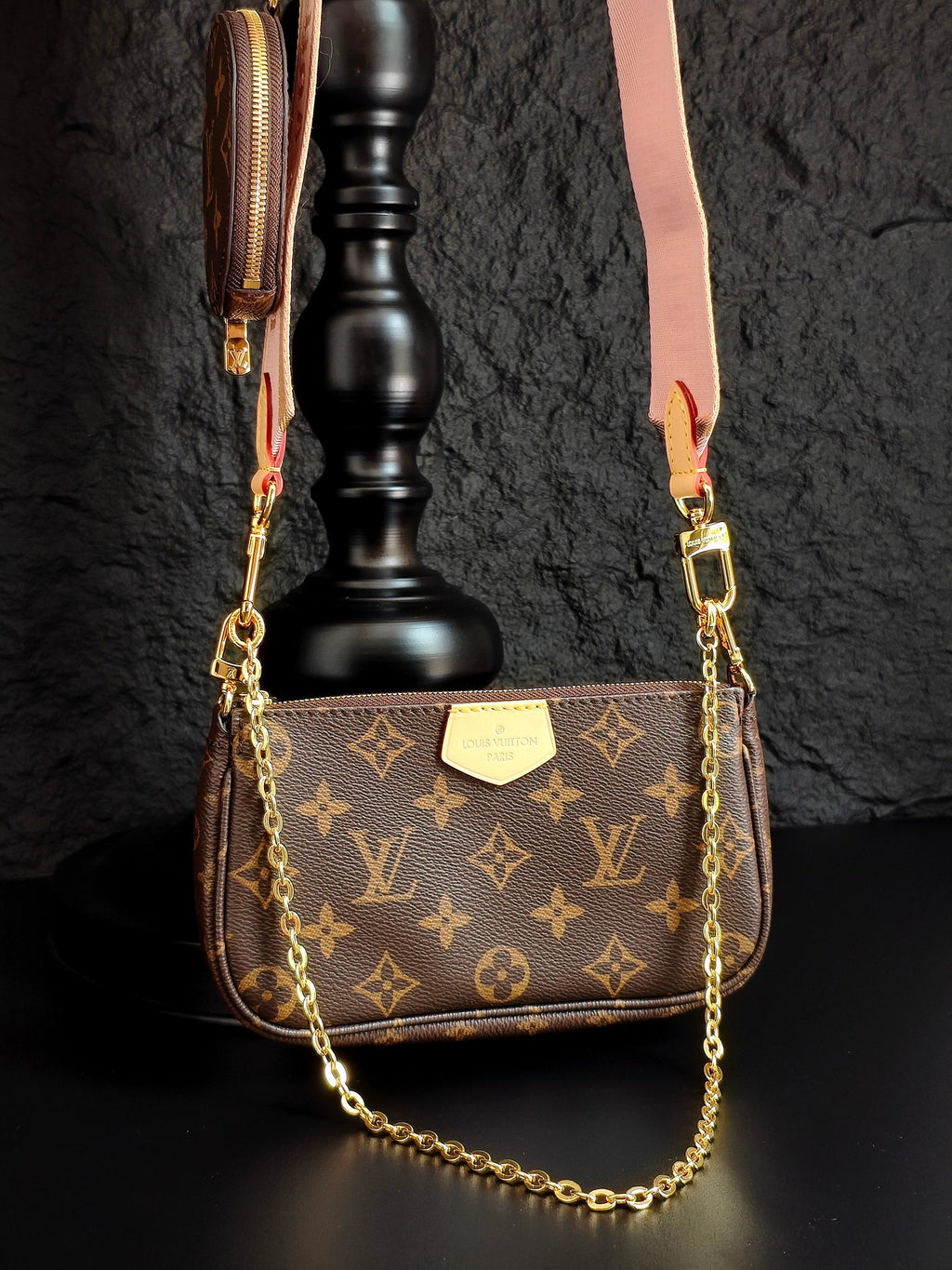 Louis Vuitton crossbody bag with monogram canvas and gold chain, front flap and label plate