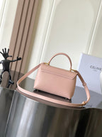 Celine mini handbag in pale pink with flap and gold-tone logo front