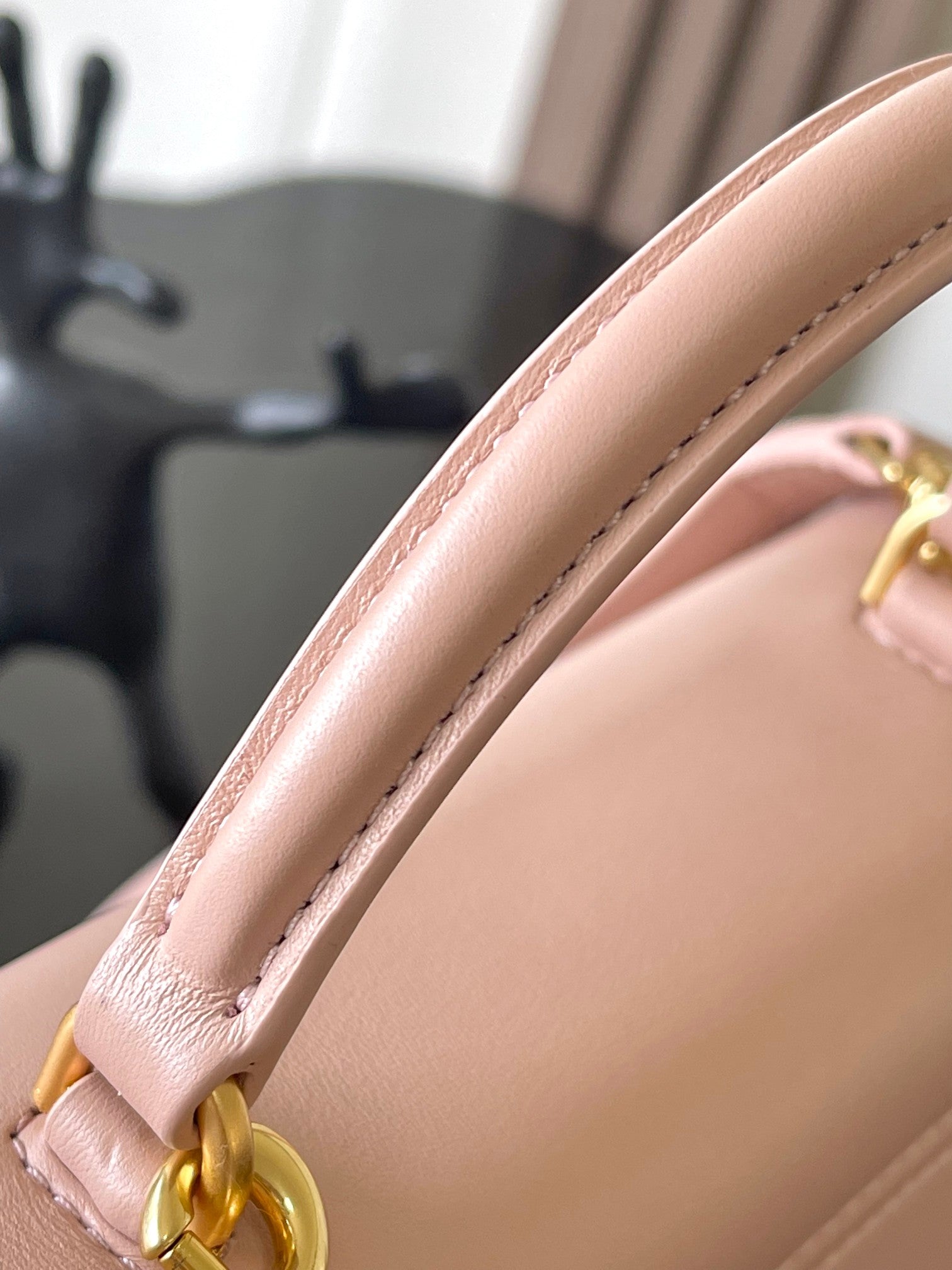 Celine handbag strap and corner stitching on pale pink leather