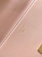 Pale pink leather interior panel with stitched edge and embossed Celine logo