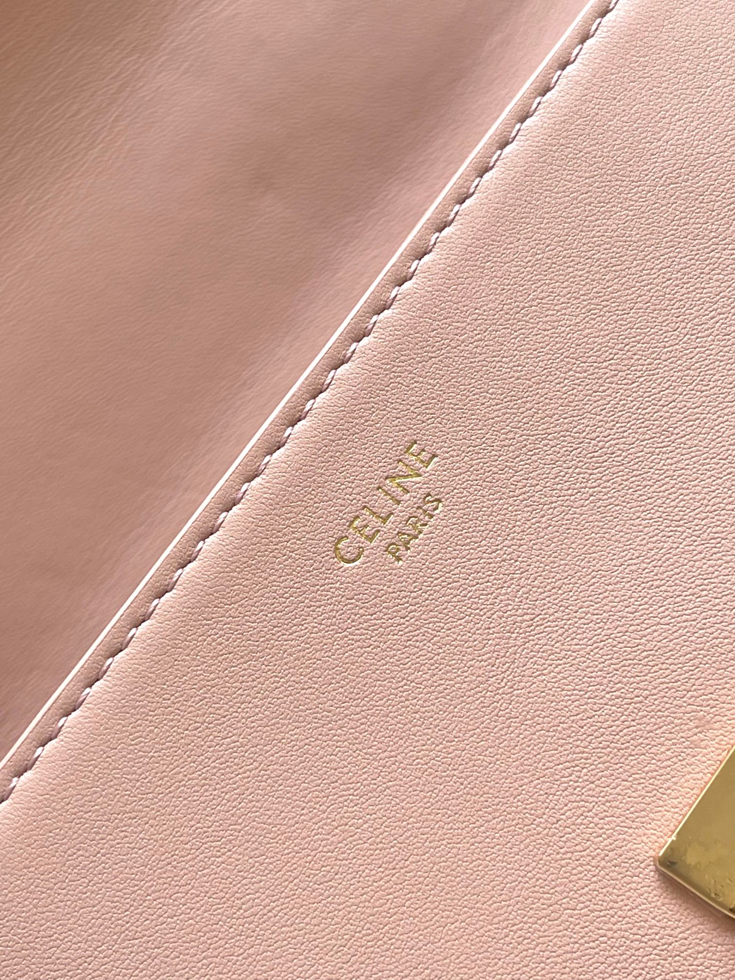 Pale pink leather interior panel with stitched edge and embossed Celine logo