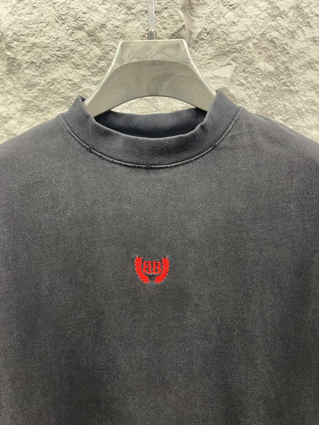 Balenciaga short-sleeve T-shirt front view, dark gray, red chest logo.