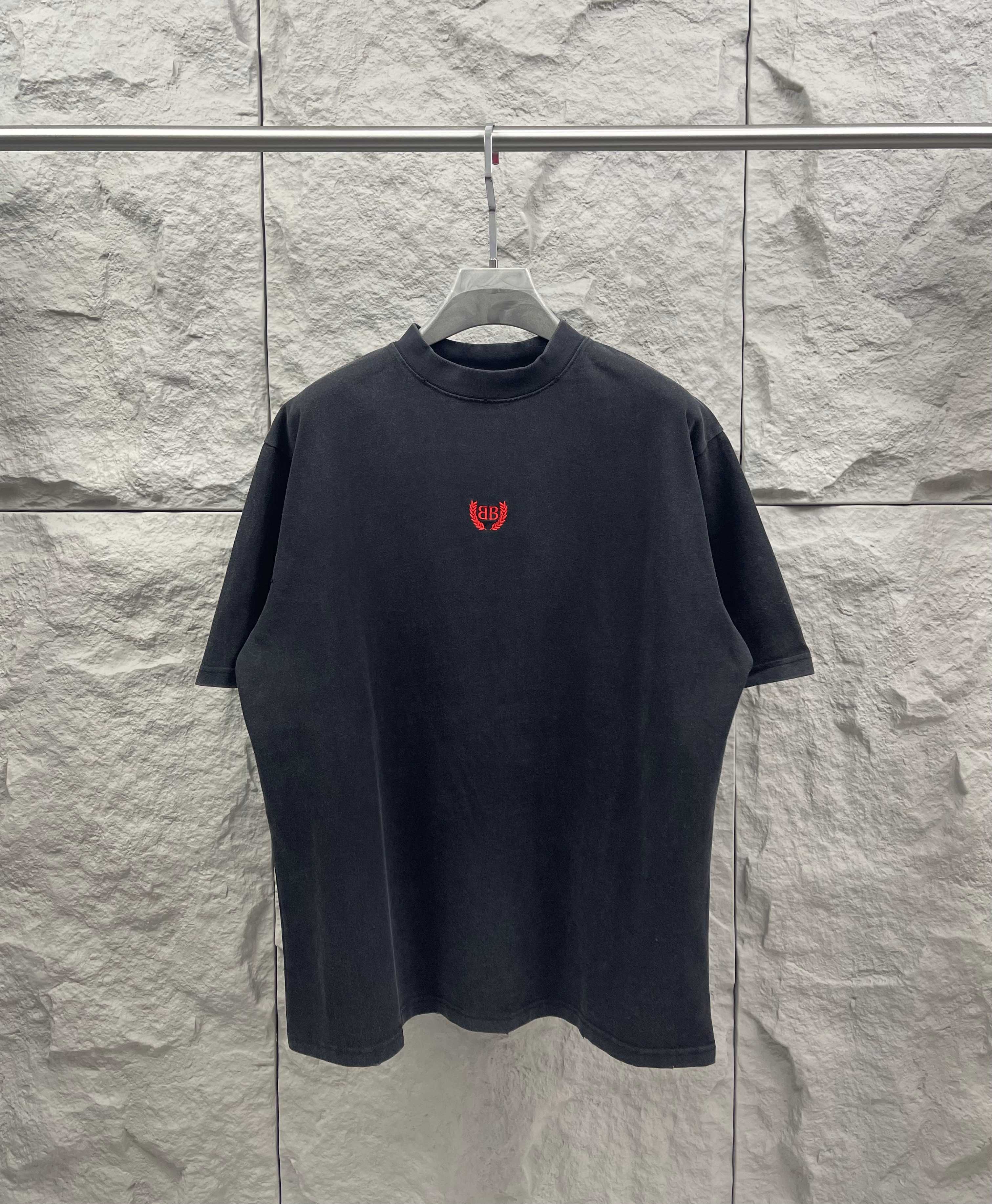 Balenciaga short-sleeve T-shirt, dark gray, crew neck, small red chest logo.