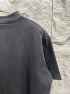 Balenciaga short-sleeve T-shirt sleeve and back, dark gray, no visible logo.