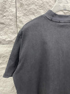 Balenciaga short-sleeve T-shirt, dark gray, crew neck and sleeve seam, side view.