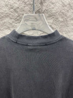 Balenciaga short-sleeve T-shirt neckline close-up, dark gray crew neck ribbing.