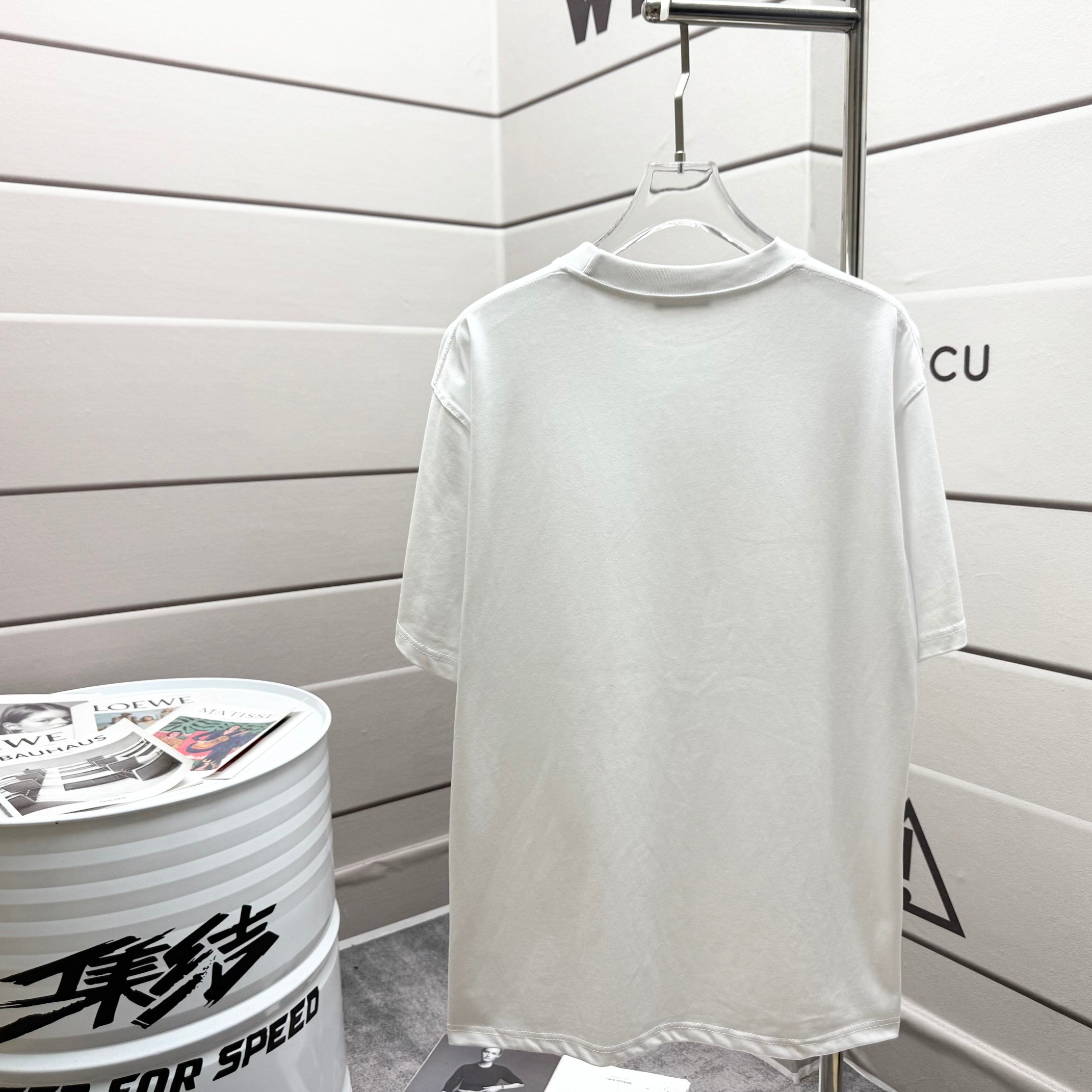 White Dior T-shirt hanging, plain front view