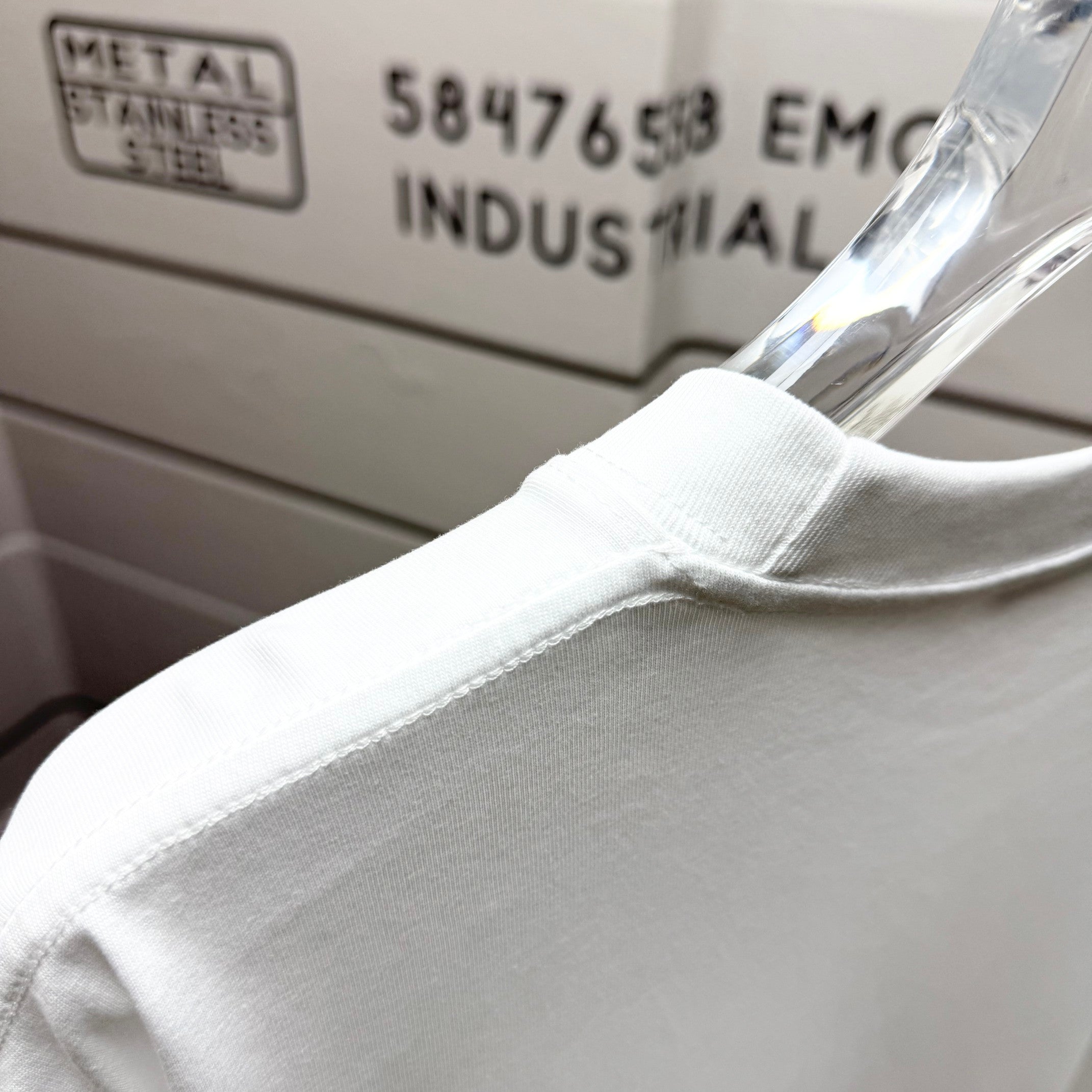 White Dior T-shirt shoulder seam close-up