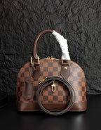 Louis Vuitton handbag, brown checkered design with fur-trimmed handle and crossbody strap