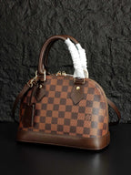 Louis Vuitton handbag with brown checkered canvas, fur handles and adjustable shoulder strap