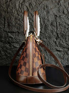 Louis Vuitton handbag, brown checkered drawstring-style top with zip and shoulder strap