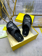 Fendi black leather slide sandals with crisscross strap and platform sole, pair