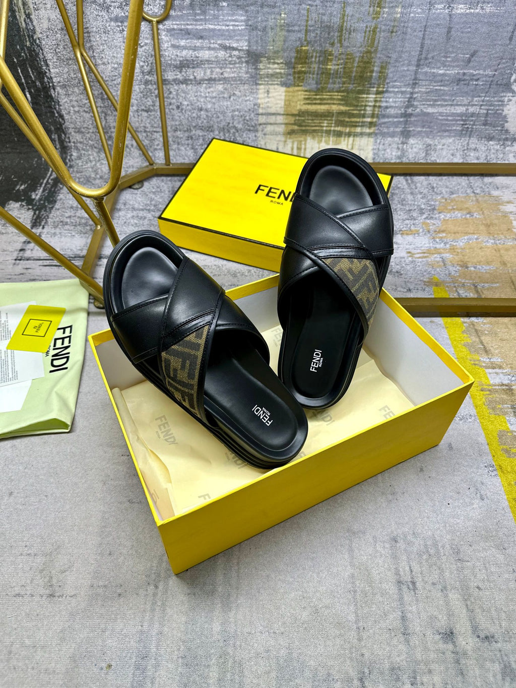 Fendi black slide sandals with FF logo band, thick sole and slide design