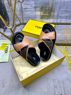 Fendi slide sandals with tan straps and black platform-style soles, top view