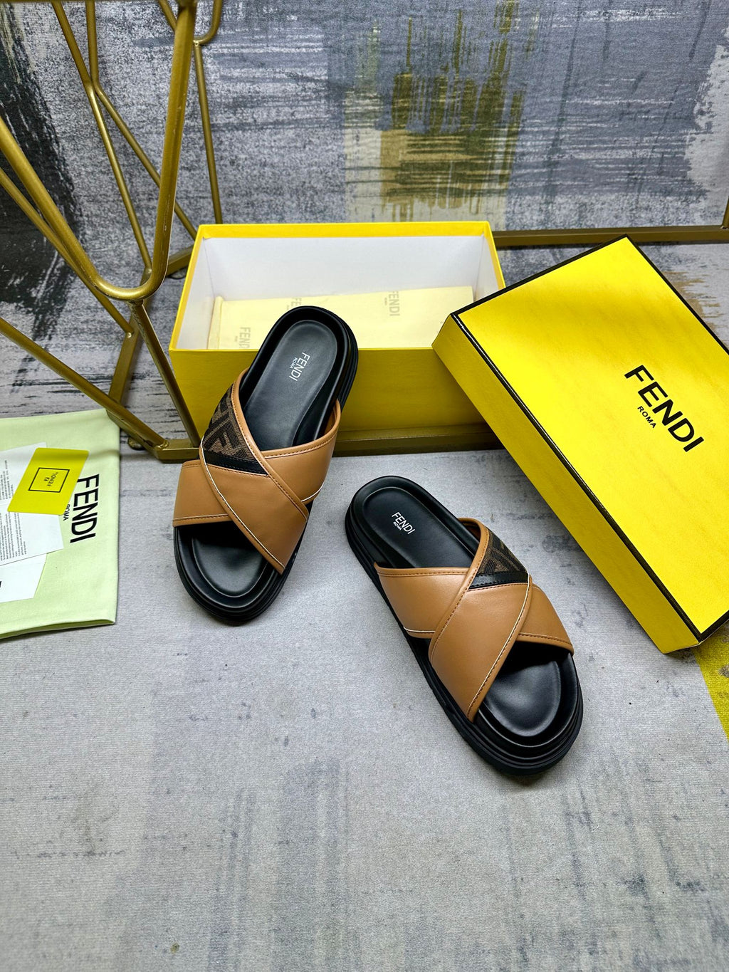 Fendi sandals with tan leather straps and black soles, angled view