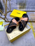 Fendi sandals with tan straps and black footbeds, stacked pair view
