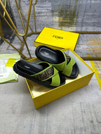 Green Fendi sandals with FF logo straps, black slide sole, logo-lined footbed