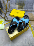 Blue leather slide sandals with crisscross straps and black soles, FENDI on footbed