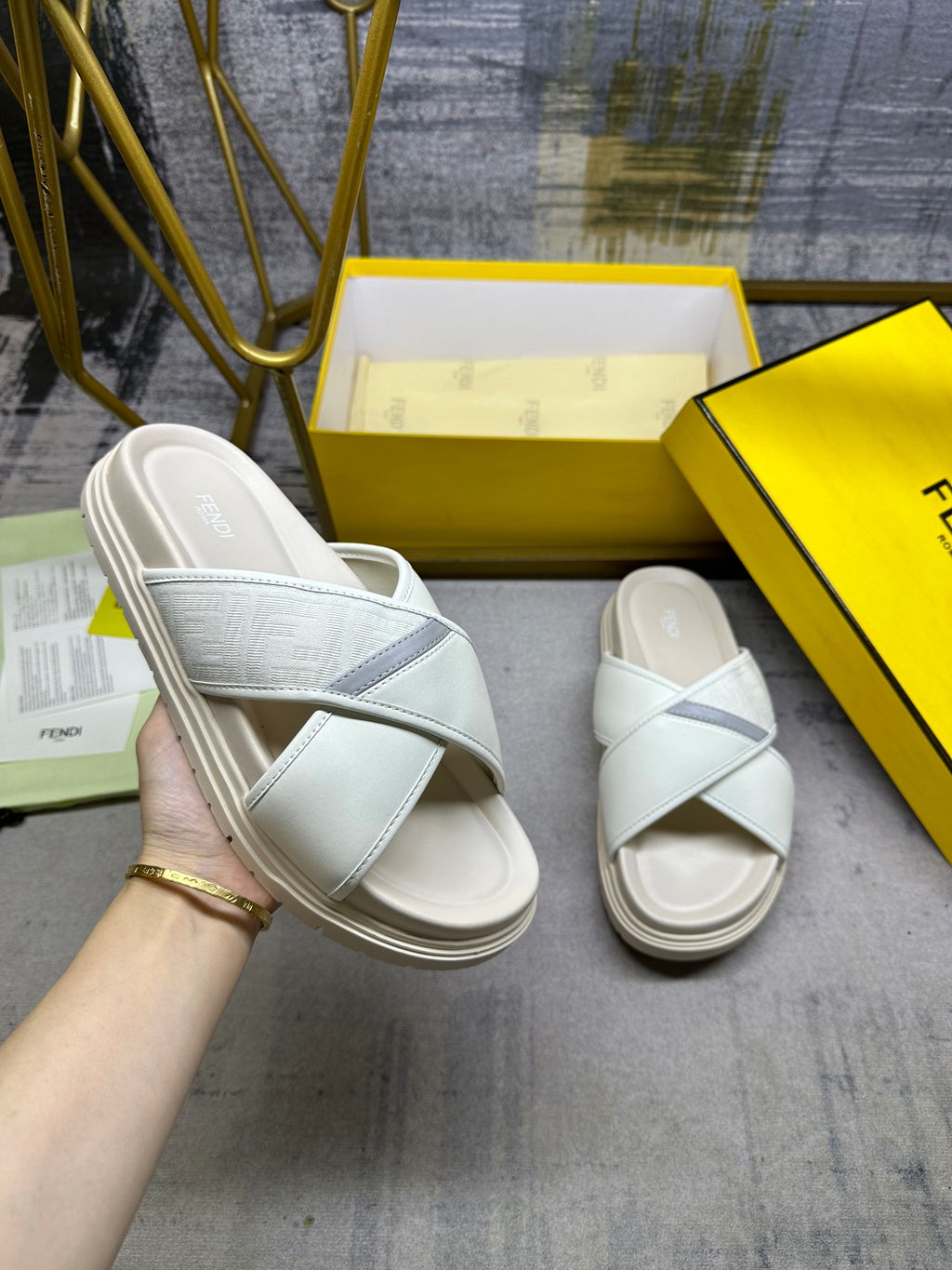 Fendi white slide sandals with cross straps and cushioned footbed