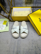 Fendi white slide sandals, front view, open toe and cross straps
