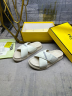 Fendi white sandals with cross over straps and low rubber sole