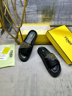 Black slide sandals with FF-pattern band across the strap