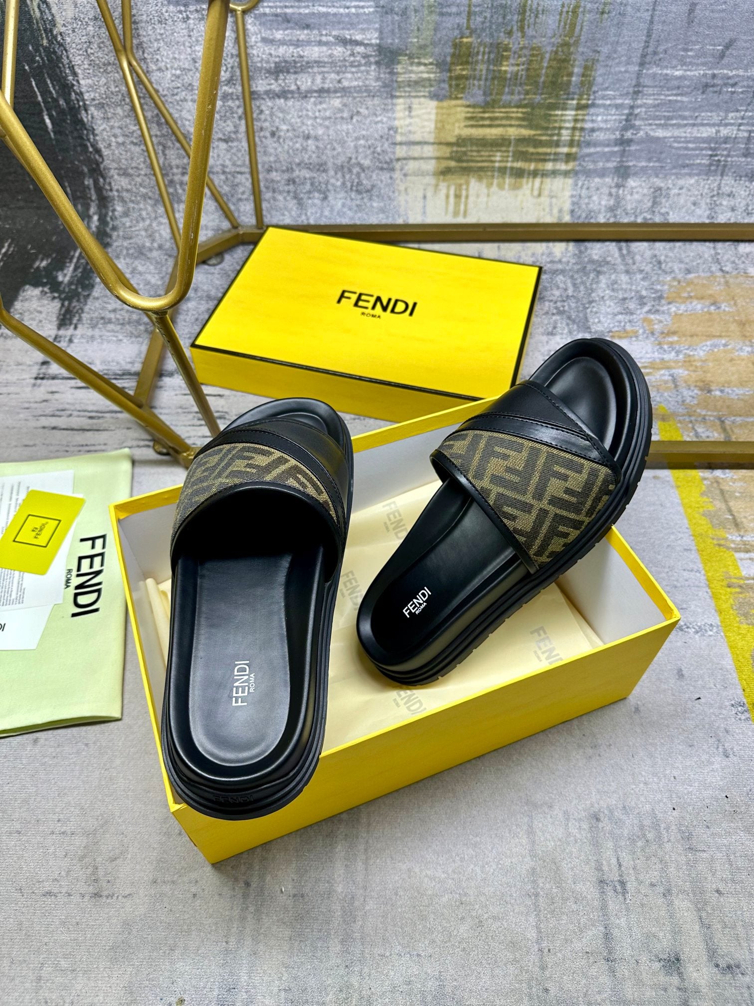 Black slide sandals with FF monogram strap and contoured footbed