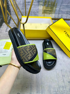 Fendi slide sandals with black leather-look straps and green trim, FF logo band
