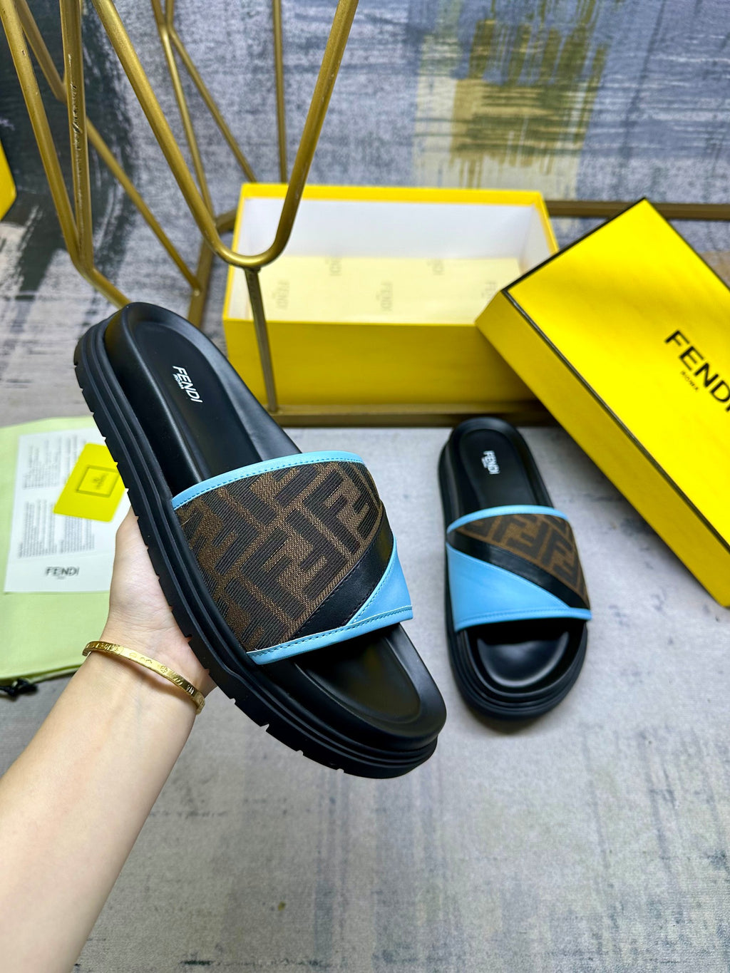 Fendi slide sandals with black leather and blue strap, FF logo band