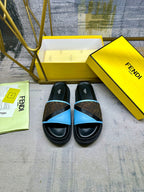 Fendi slide sandals, front view with black base and blue cross strap