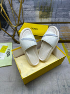 Fendi slide sandals, set on box, white textured straps and light blue crossover
