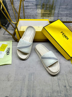 Fendi slide sandals, angled view with white upper and light blue strap over open toe