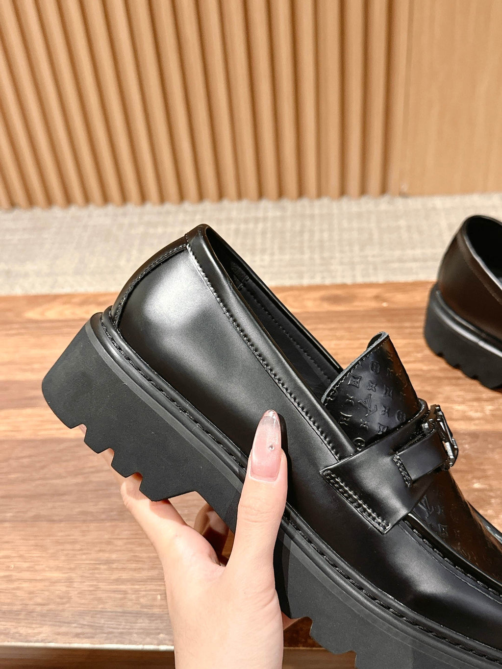 Black leather loafer with strap buckle and chunky sole edge detail