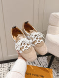 Beige suede unisex sneakers with white lace-up front and dark heel tabs