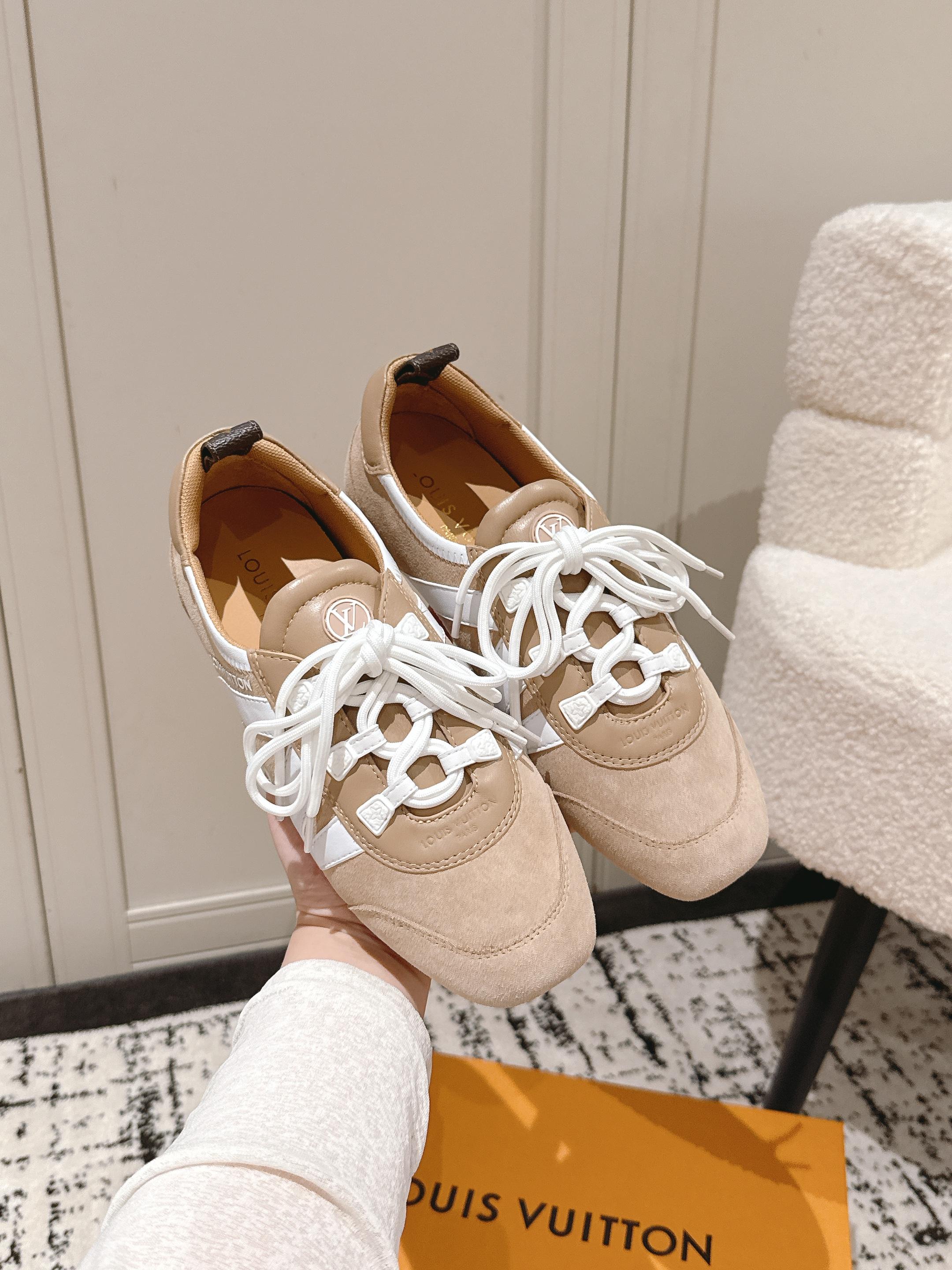 Beige suede unisex sneakers with white lace-up front and dark heel tabs
