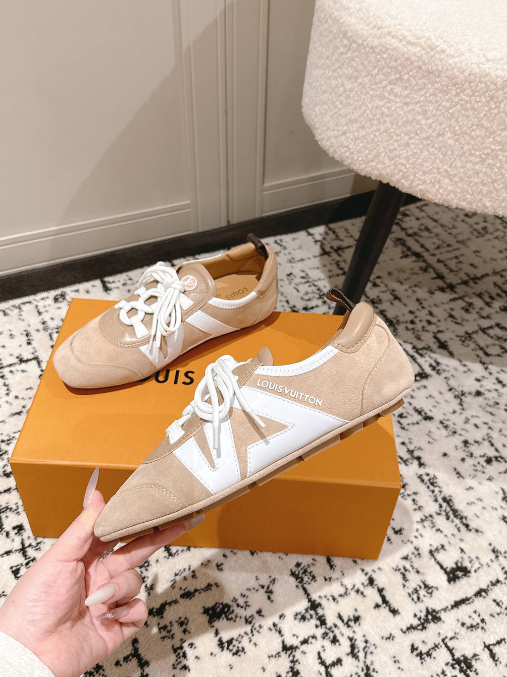 Beige suede lace-up sneakers with white side panels and low-profile sole
