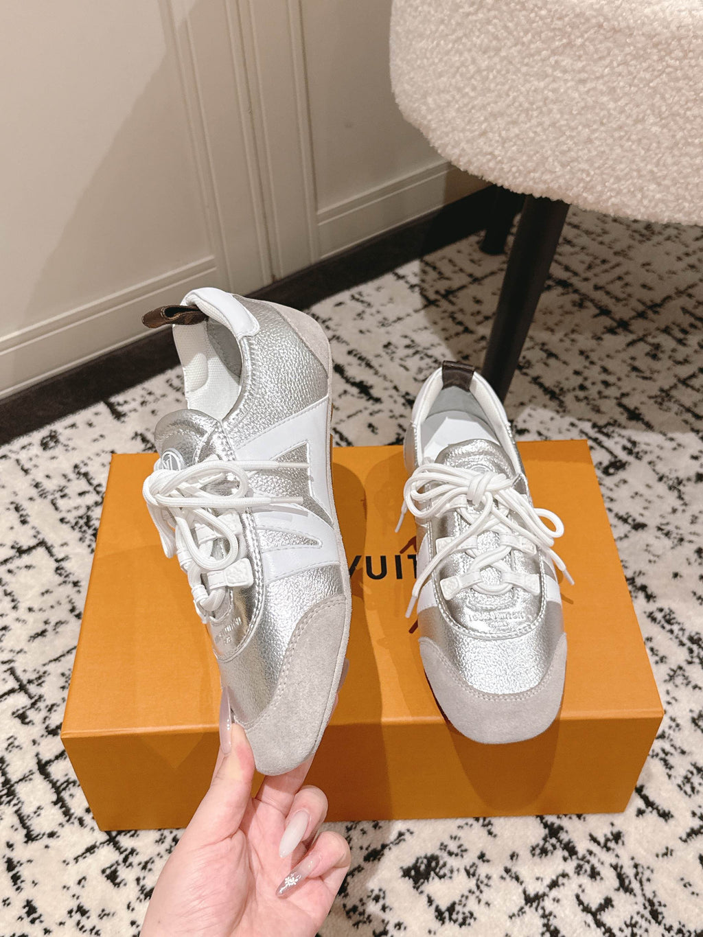 Louis Vuitton metallic silver sneakers with white laces and padded collar