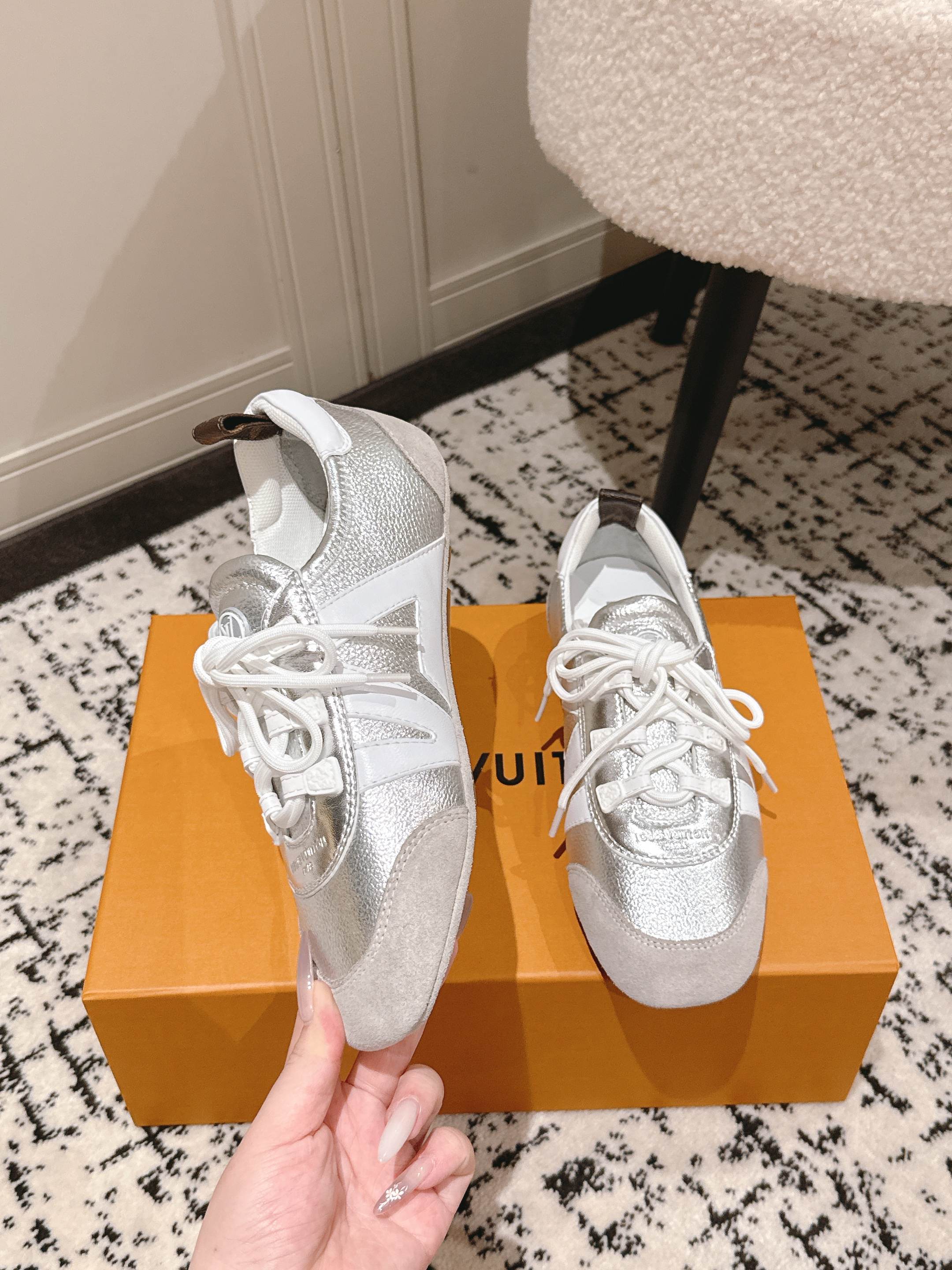 Louis Vuitton metallic silver sneakers with white laces and padded collar