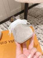 Louis Vuitton metallic silver low-top sneakers showing back heel and top view