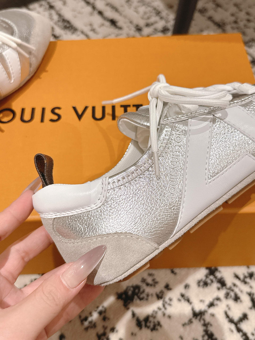 Louis Vuitton metallic silver sneakers with white laces and textured panel detail