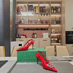Red strappy high-heel sandals with crystal buckle on pointed toe