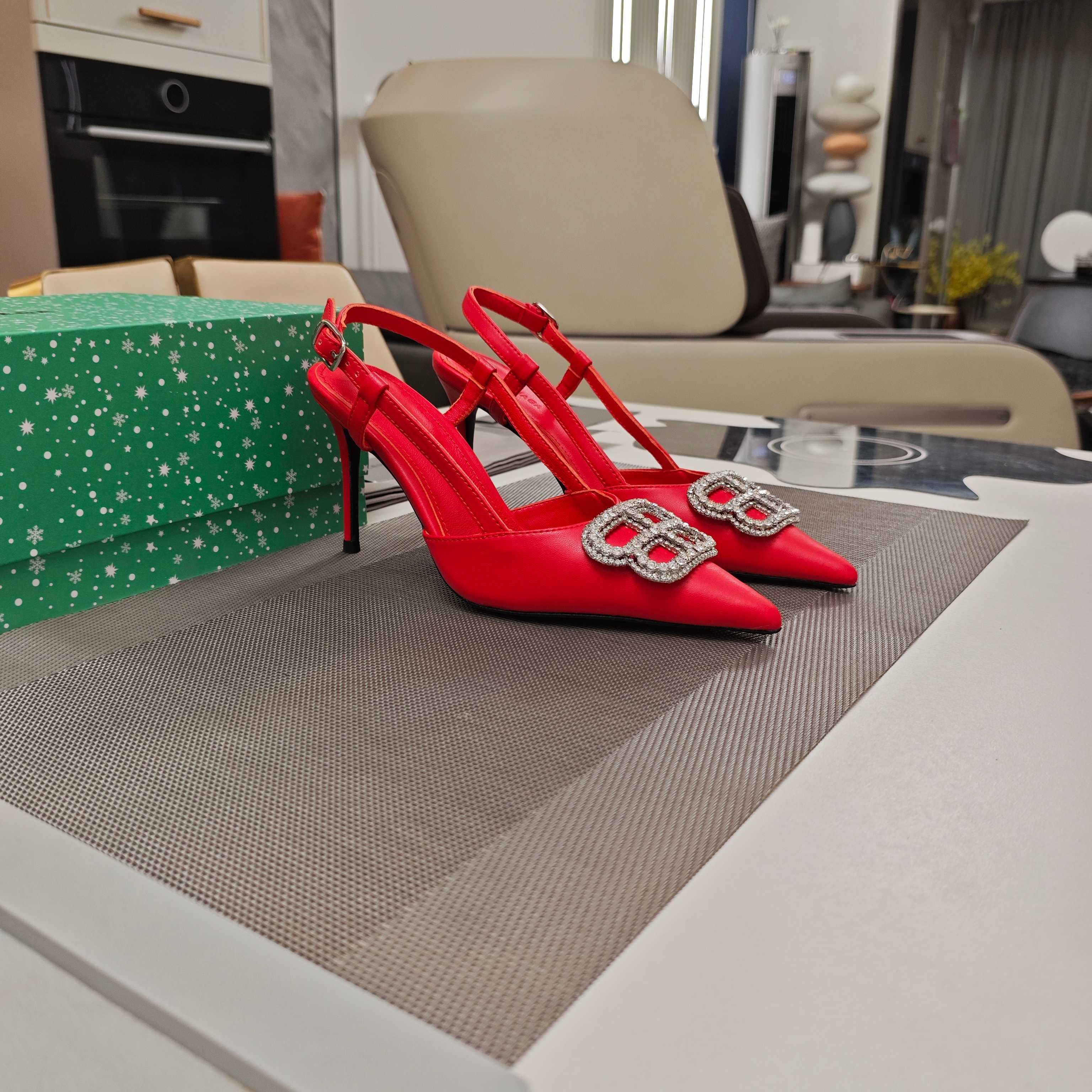 Red pointed-toe slingback high-heel sandals with jeweled buckle