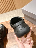Balenciaga black clog sandals heel view with textured strap and small side logo
