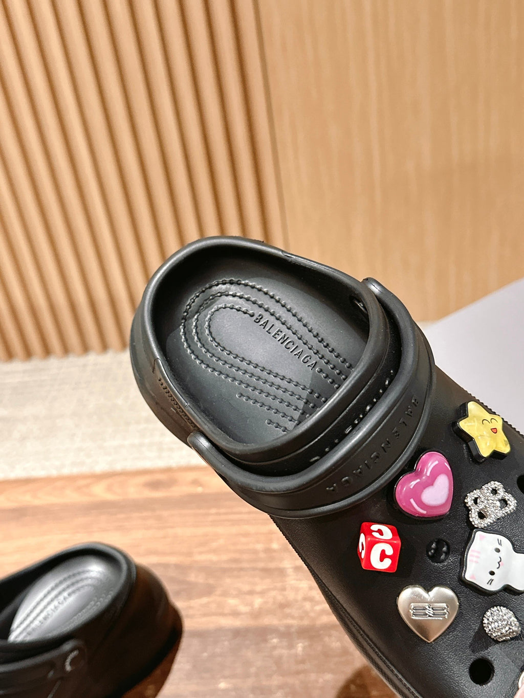 Balenciaga black clog sandals interior view with cushioned footbed and stitched logo